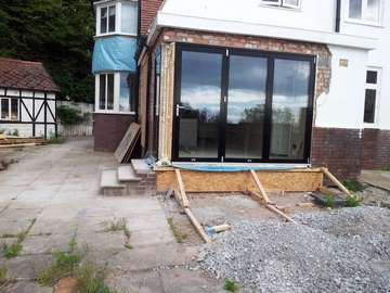 Mr M : West Kirby wirral : Installation of Centor C1t. Triple glazed Bi folding doors in Marine finsh Black Polyester Powder coated Alumnium. Referbishment were carried out by the client. External pressing to be carried out by specialist company Example of aluminium triple glazed bi-fold doors. Aluminium bi-fold doors near Macclesfield SK11. Alumnus doors with 44mm triple glazing near Alderly Edge SK9. Aluminium Bi-fold doors near Wirral CH48 CH60. Alumnus Bi-fold doors triple glazed Liverpool Formby L37 near South Port PR8 Bi-fold doors near Crosby L23